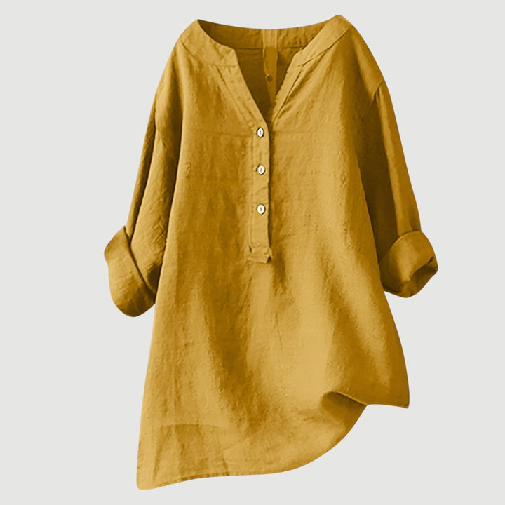 Elegant women's loose fit V-neck top, a breathable blouse offering everyday comfort and sophisticated style.