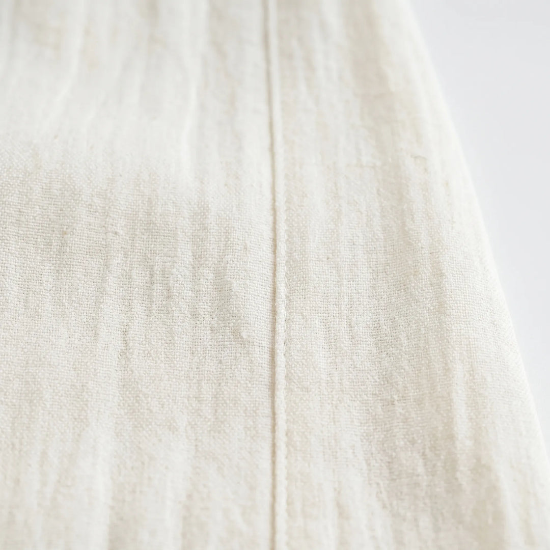 Relaxed beige women's wide leg trousers, ideal for airy, loose fit summer casual wear.