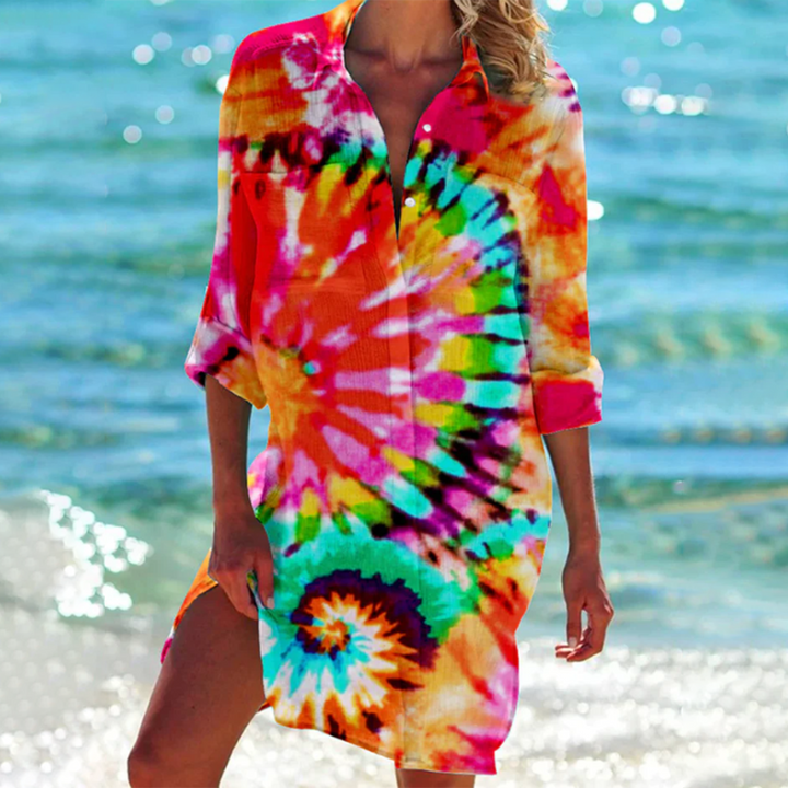 Women's loose printed summer shirt with pockets. Ideal for casual, beach, or holiday wear. Short sleeve, flowy style.