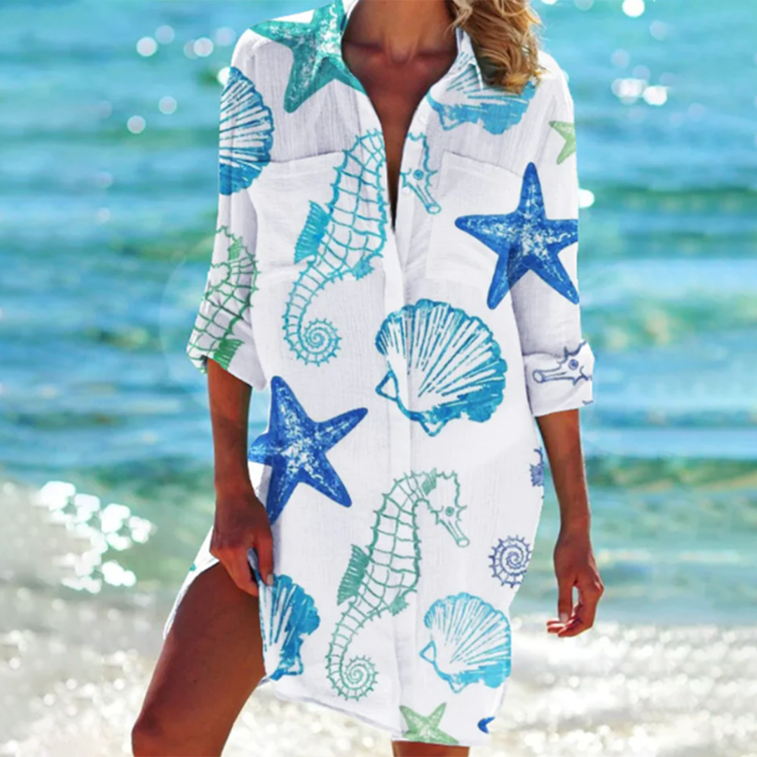 Effortless women's summer tunic top. Loose fit, colorful print, short sleeves & practical pockets for comfort.