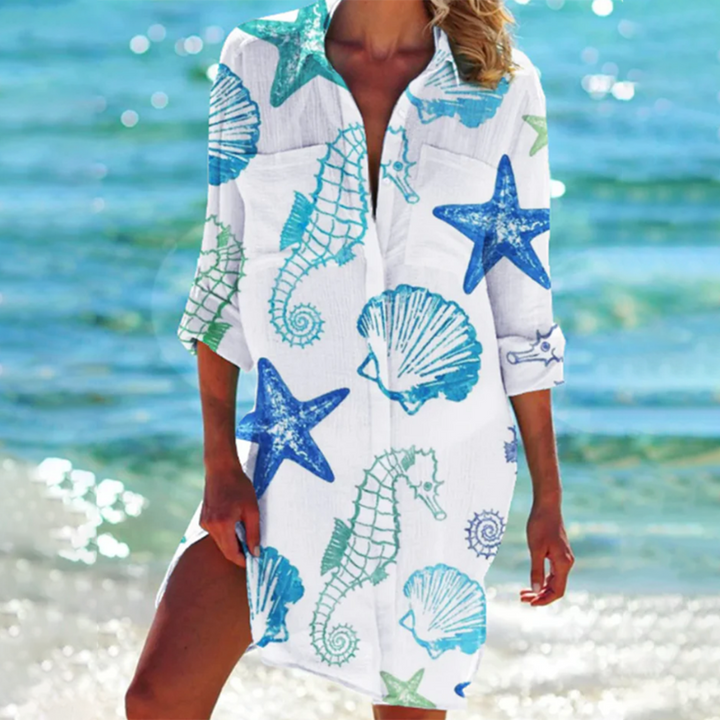 Effortless women's summer tunic top. Loose fit, colorful print, short sleeves & practical pockets for comfort.