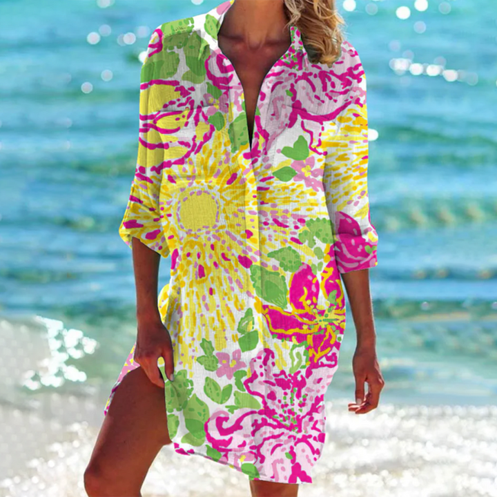 Chic women's loose fit summer top. Features colorful prints, short sleeves & pockets. Perfect for relaxed holiday wear.