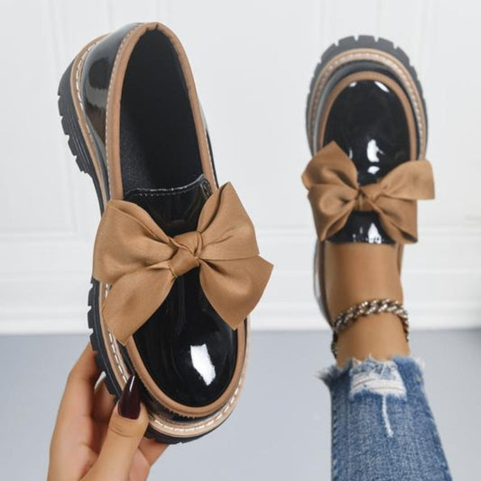 Women's Lucente black patent bowknot loafers with platform sole, stylish slip-on flats for everyday comfort.