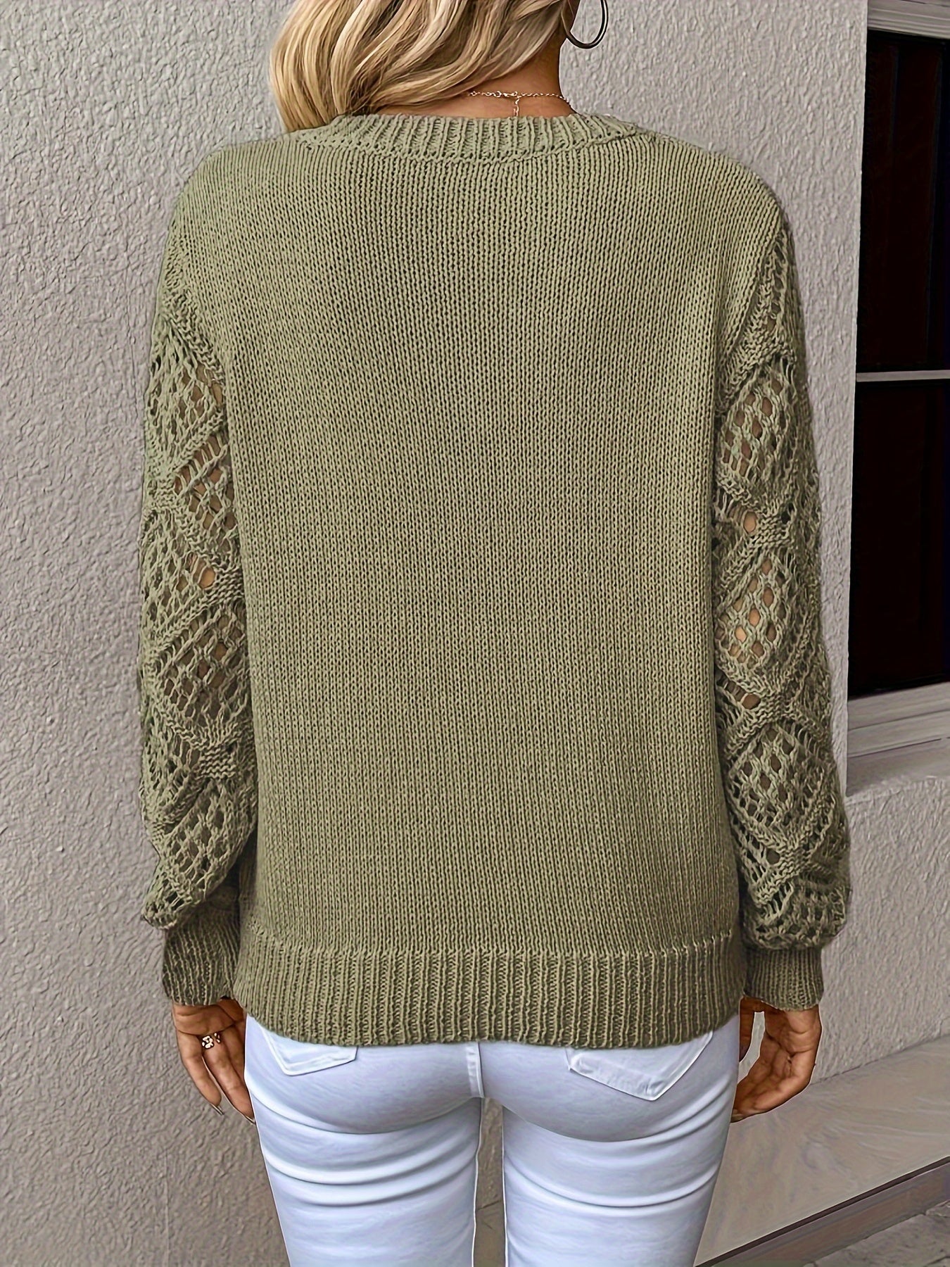 Women's fashion-forward Luna sweater, a V-neck long sleeve top with stylish hollow-out sleeves.