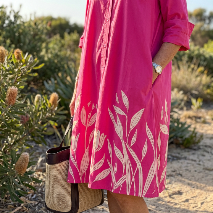 Luxe women's floral fuchsia midi dress. Effortlessly elegant button-down shirt dress for any summer occasion.