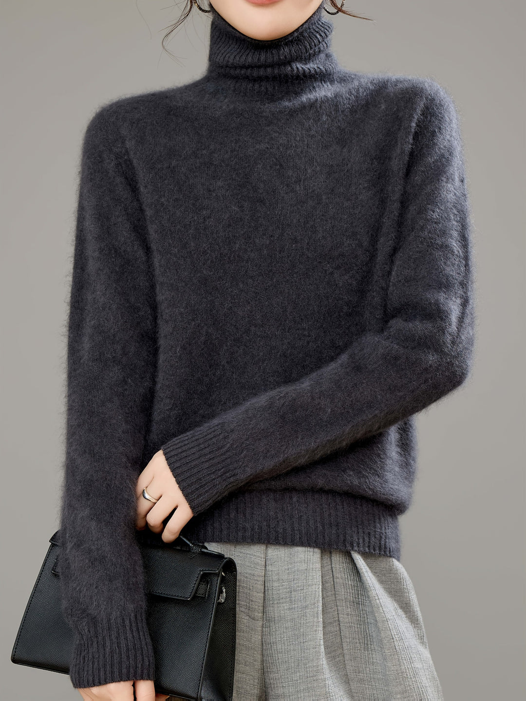 Luxe women's turtleneck sweater combines ultimate comfort with practical warmth for cold weather.