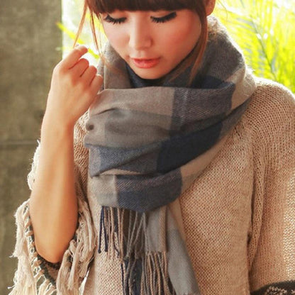 Women's warm cashmere check scarf elegantly draped, a chic winter fashion essential.