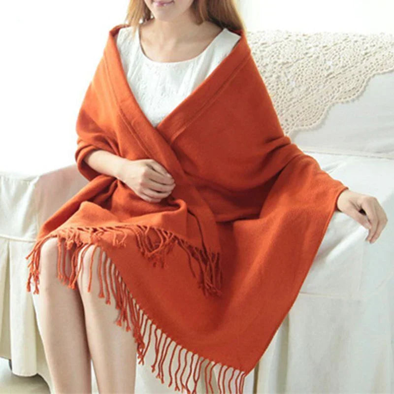 Luxurious soft texture of a women's cashmere check pattern scarf, warm & elegant for winter.