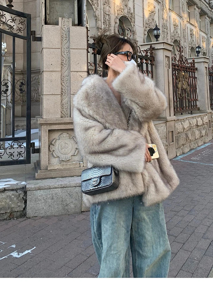 Warm women's winter coat, luxurious soft fabric, elegant outerwear for chic cold weather style.