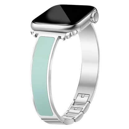 Sleek women's Apple Watch cuff band made of polished stainless steel with a chic enamel inlay.