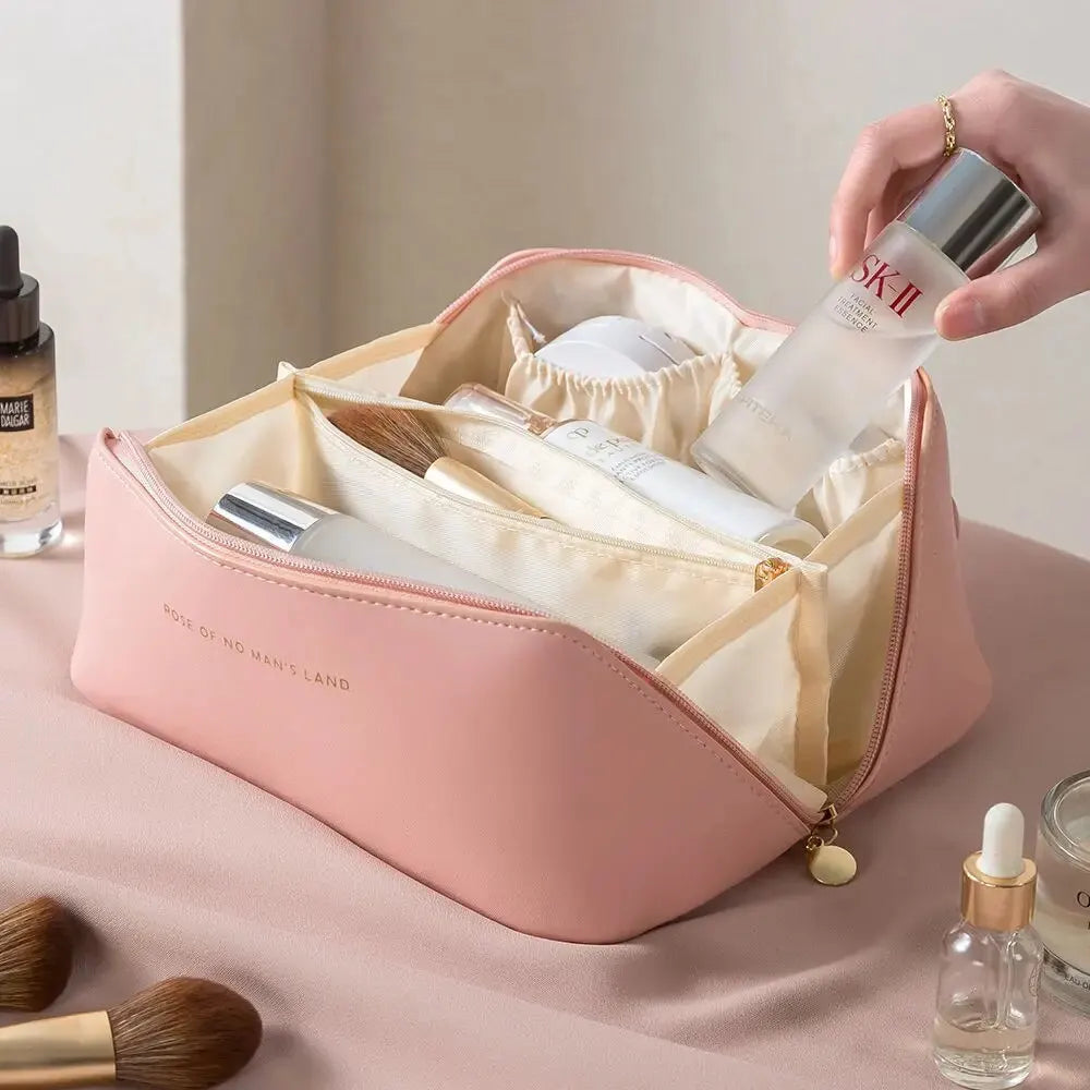 Glamorous women's travel makeup organizer bag, a luxury PU leather cosmetic case with zipper for organized trips.