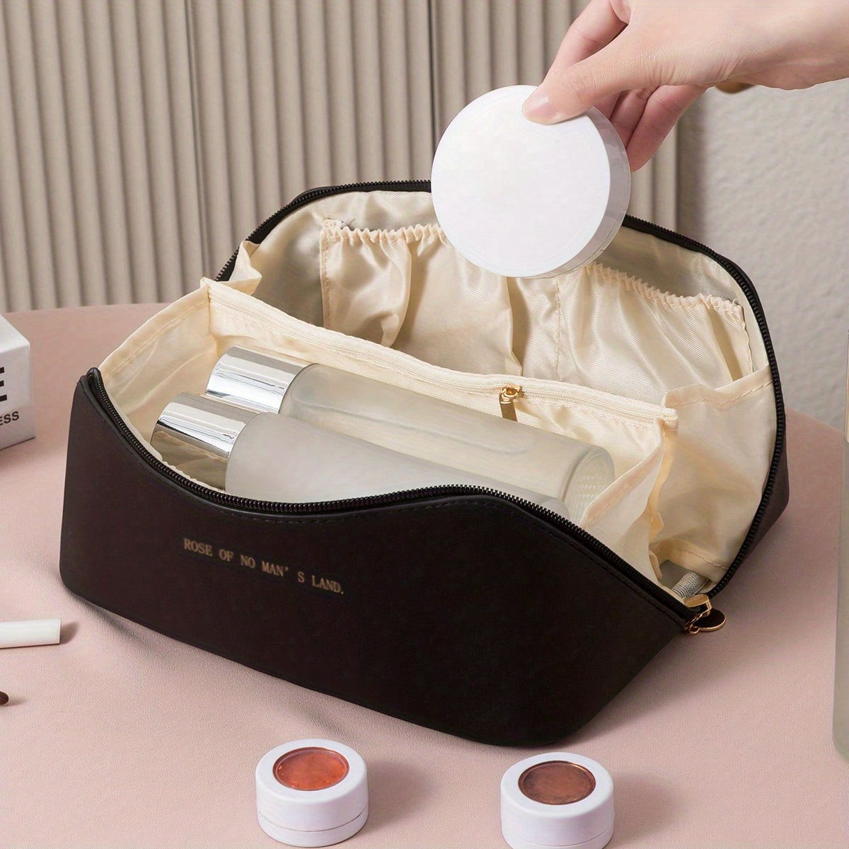 Women's luxury toiletry bag, a versatile travel makeup organizer and accessory pouch with a strong zipper.