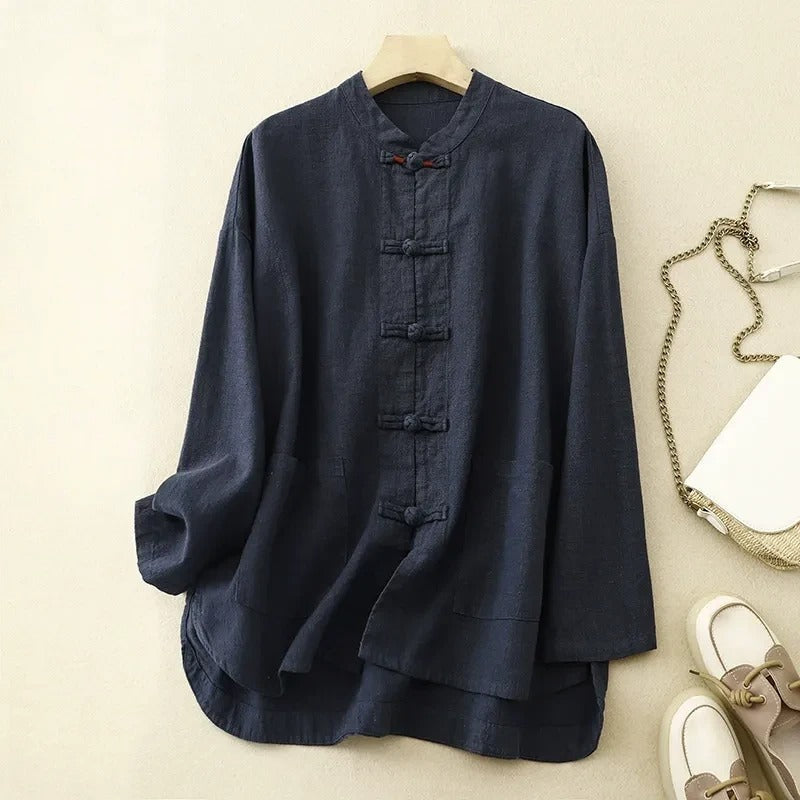Women's Madina flowy button-front shirt. Versatile long-sleeve blouse for casual or office wear, chic spring/summer style.