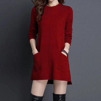 Cozy women's Madison cable knit midi sweater dress, relaxed fit, perfect for elegant winter casual wear with pockets.