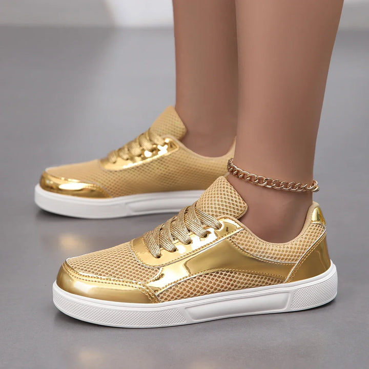 Women's shiny metallic mesh lace-up sneakers. Trendy, comfortable footwear for casual, everyday fashion.