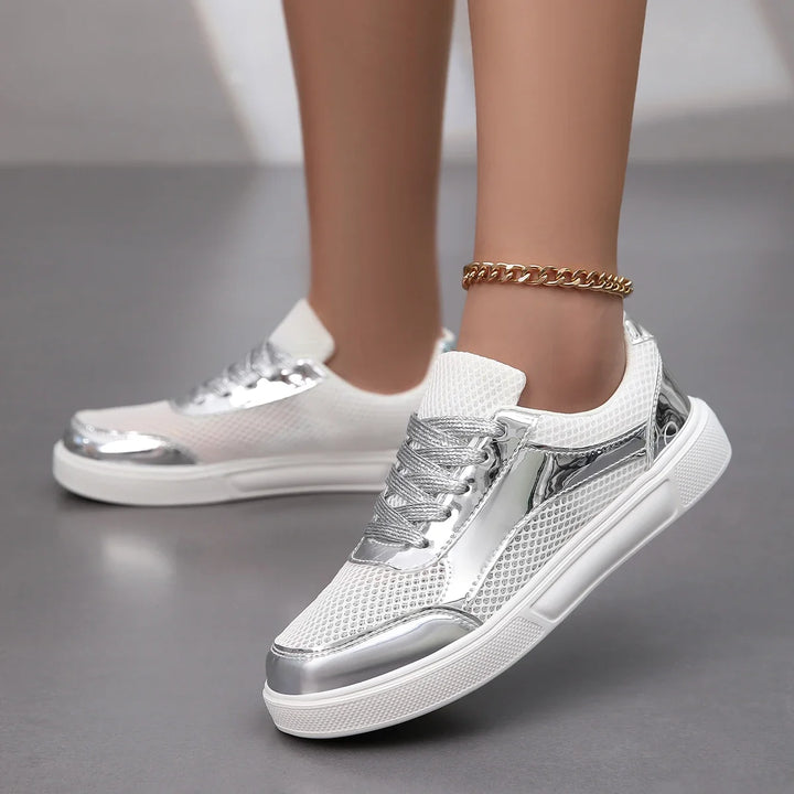 Lightweight metallic mesh lace-up sneakers for women. Stylish and comfortable casual footwear, ideal for everyday.