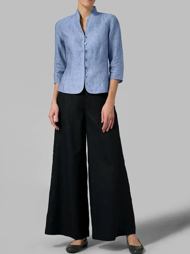 Relaxed-fit women's button-front blouse with 3/4 sleeves. A versatile, minimalist top for work or everyday chic.