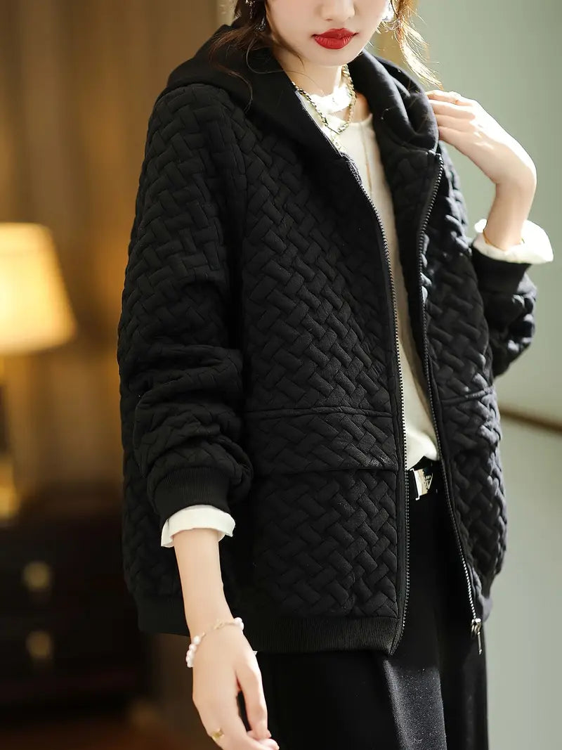 Sophisticated women's Mirelle quilted jacket with a cozy hood, ideal for winter fashion layering.