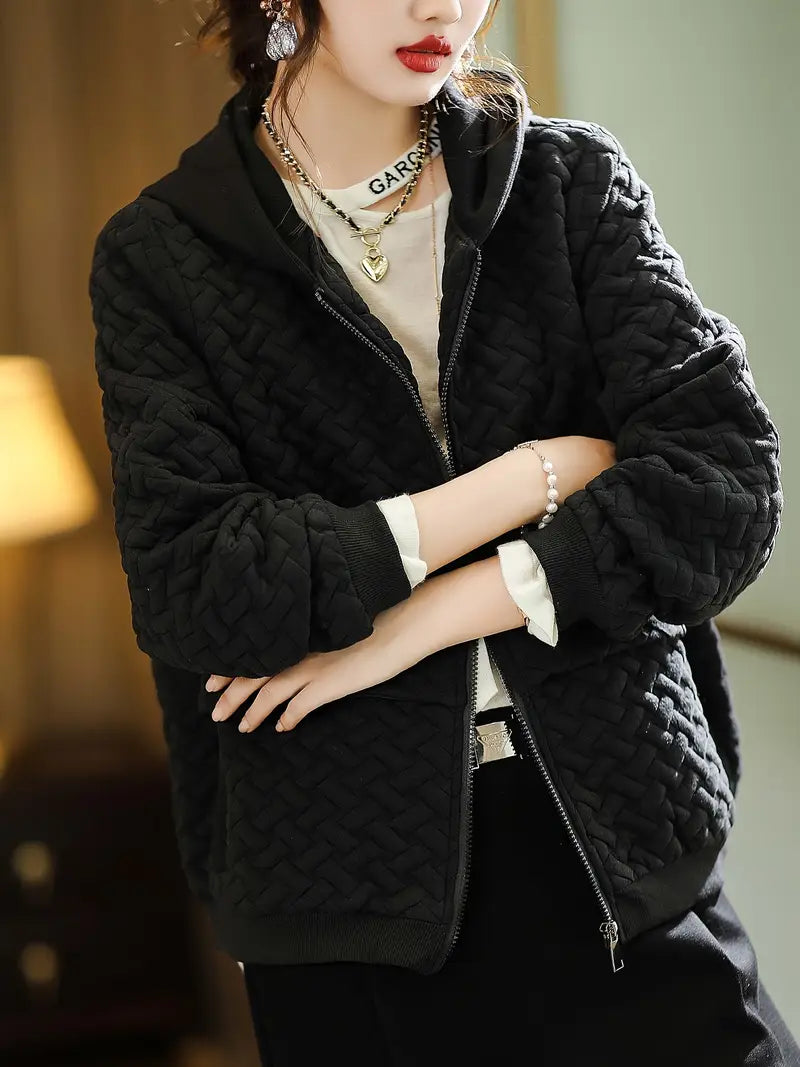 Chic hooded women's quilted jacket, a perfect modern layering solution for cozy casual style.