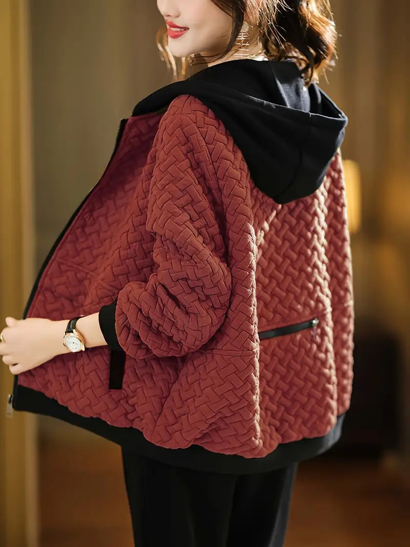 Warm women's Mirelle quilted hoodie jacket, a cozy zip-up for comfortable winter fashion.
