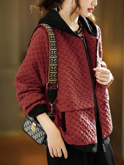Essential women's quilted hooded jacket, a versatile piece for stylish casual layering in winter.