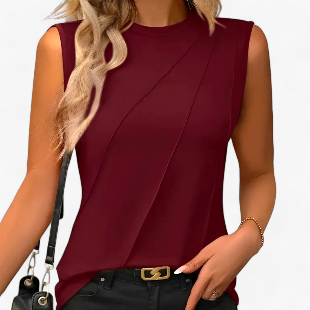 Summer-ready women's mock neck sleeveless top. Draped & flowing style offers a chic, comfortable fit.