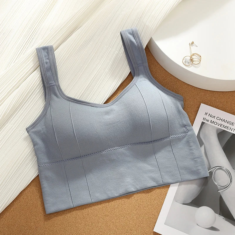Back view of women's seamless sports bra, Motion Core ribbed design, showing supportive straps for fitness.