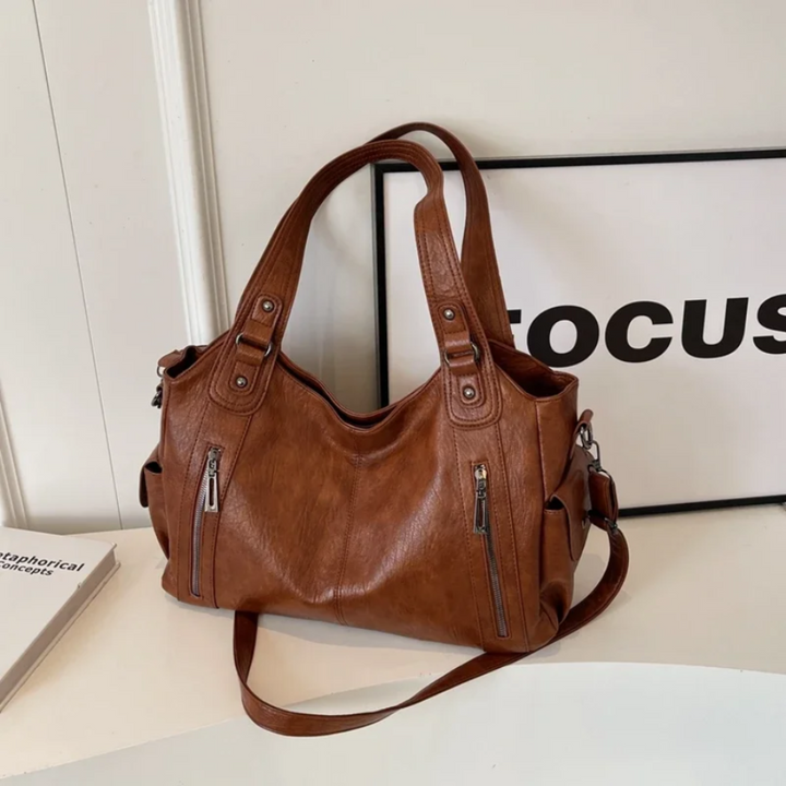 Practical multi-compartment shoulder bag for women, offering secure storage and a sophisticated look.