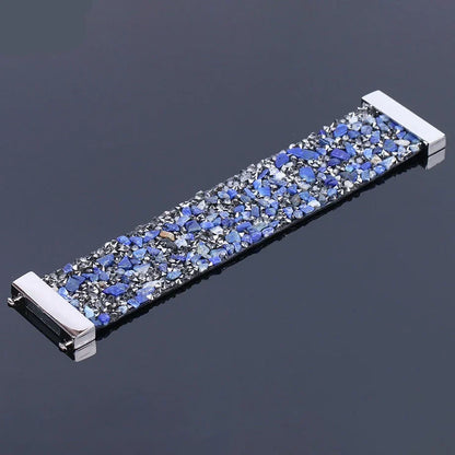 Bohemian style women's bracelet featuring natural stones, crystals, and a leather wrap.