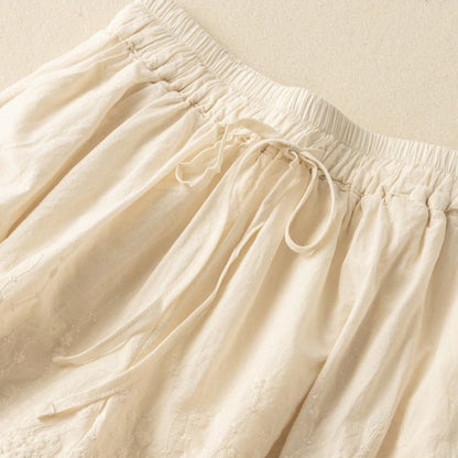 Close-up of elegant embroidery detail on Nova women's casual shorts. Stylish summer fashion.