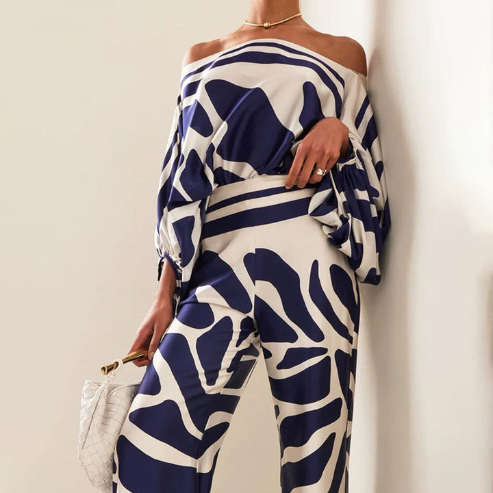 Trendy women's off-shoulder printed two-piece for summer vacations, offering a chic look.