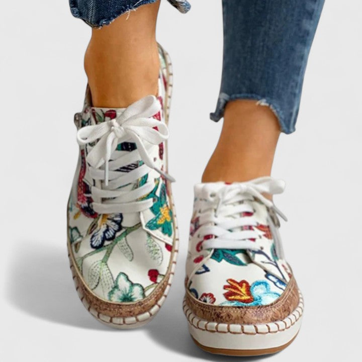 Close-up of Olisette women's slip-on walking shoes with soft, breathable material for comfortable orthopedic support.
