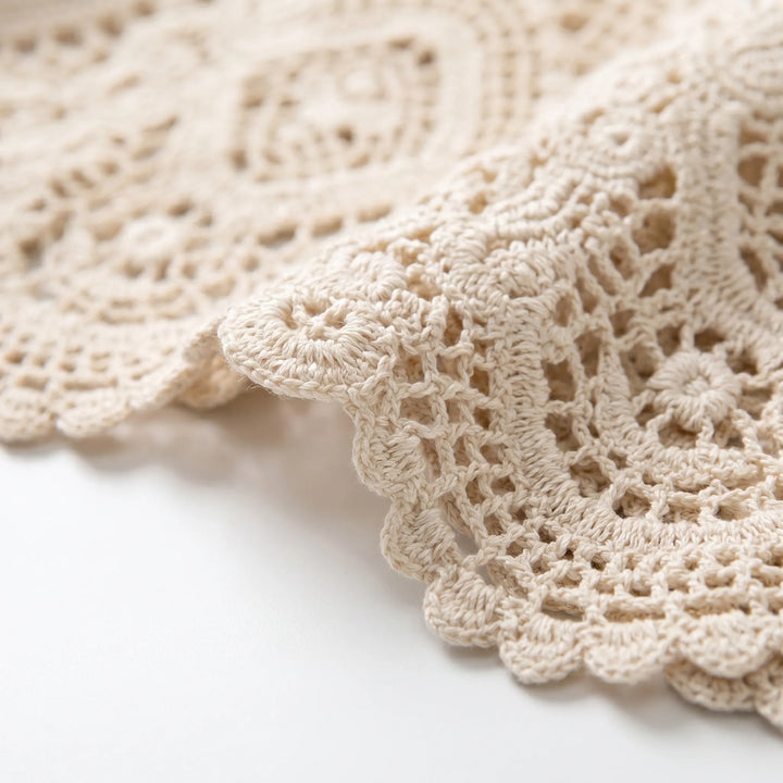 Lightweight women's apricot crochet cardigan, open-front design for chic summer fashion & resort layering.