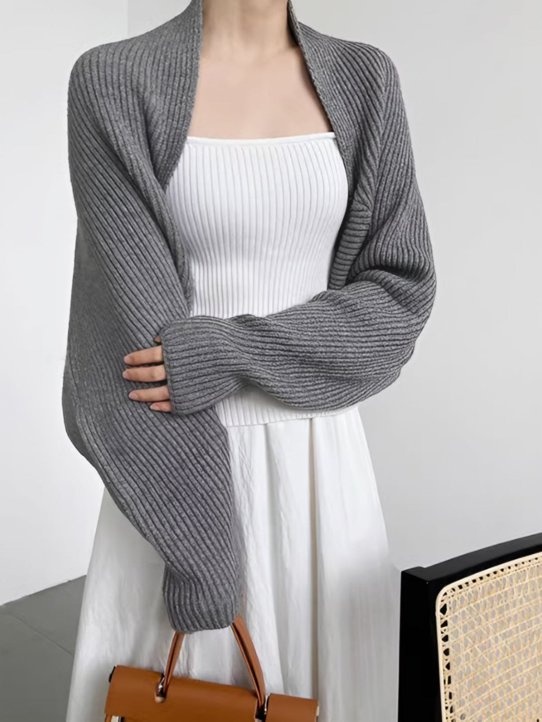 Close-up of women's open-front shrug sweater, highlighting soft fabric and regular fit detail.