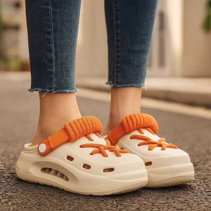 Model wearing Polar White Orbit Laced Clogs, showcasing casual style & comfortable fit.
