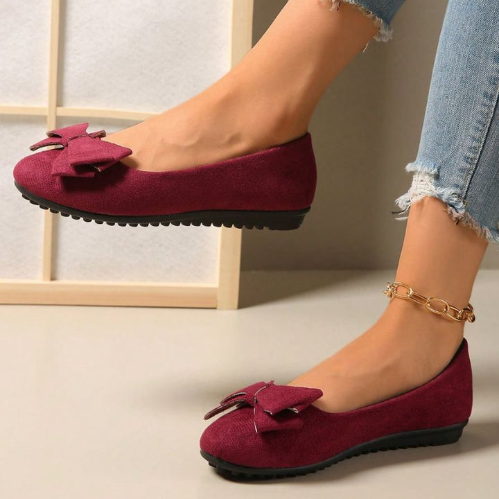 Comfortable women's wide fit flats, designed with orthopaedic features for foot health.