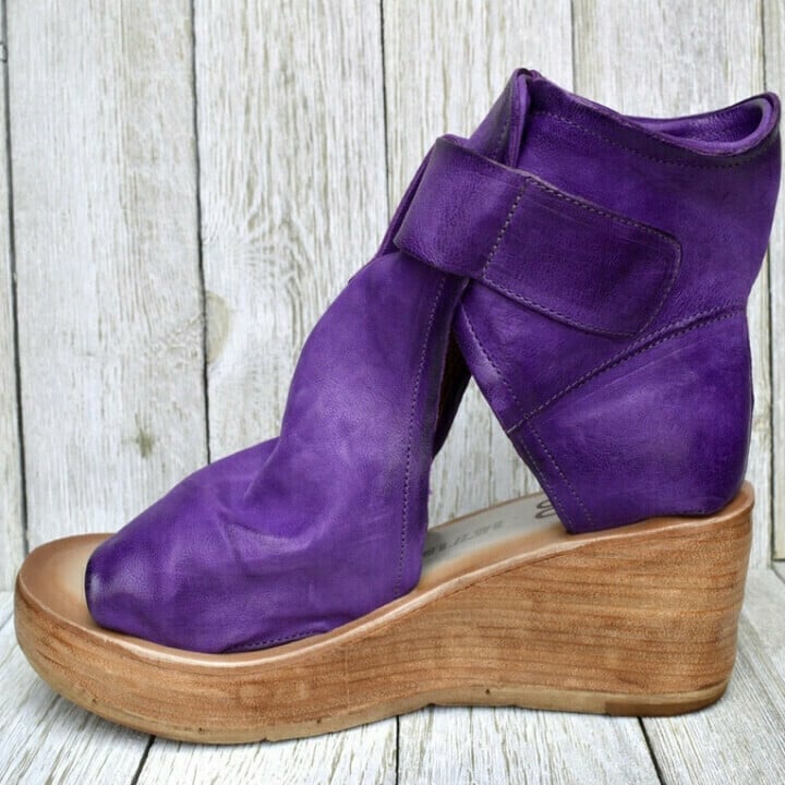 Close-up of women's orthopedic boho wedge sandals, highlighting the buckle and comfort sole.