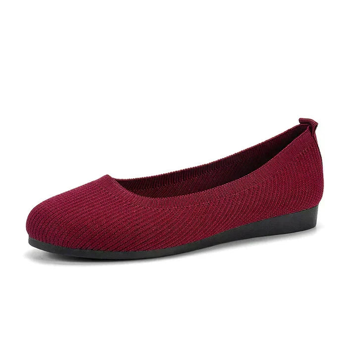 Stylish women's slip-on ballet flats with rounded toe, versatile for casual fashion & daily wear.