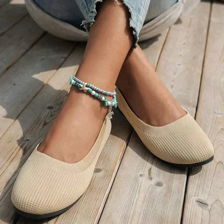 Rounded toe women's ballet flats, orthopedic comfort & slip-on design for stylish casual wear.