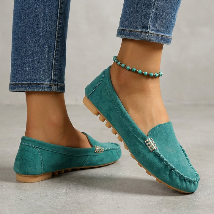 Casual women's slip-on loafers. Orthopedic driving moccasins with metallic detail for stylish, comfortable everyday wear.