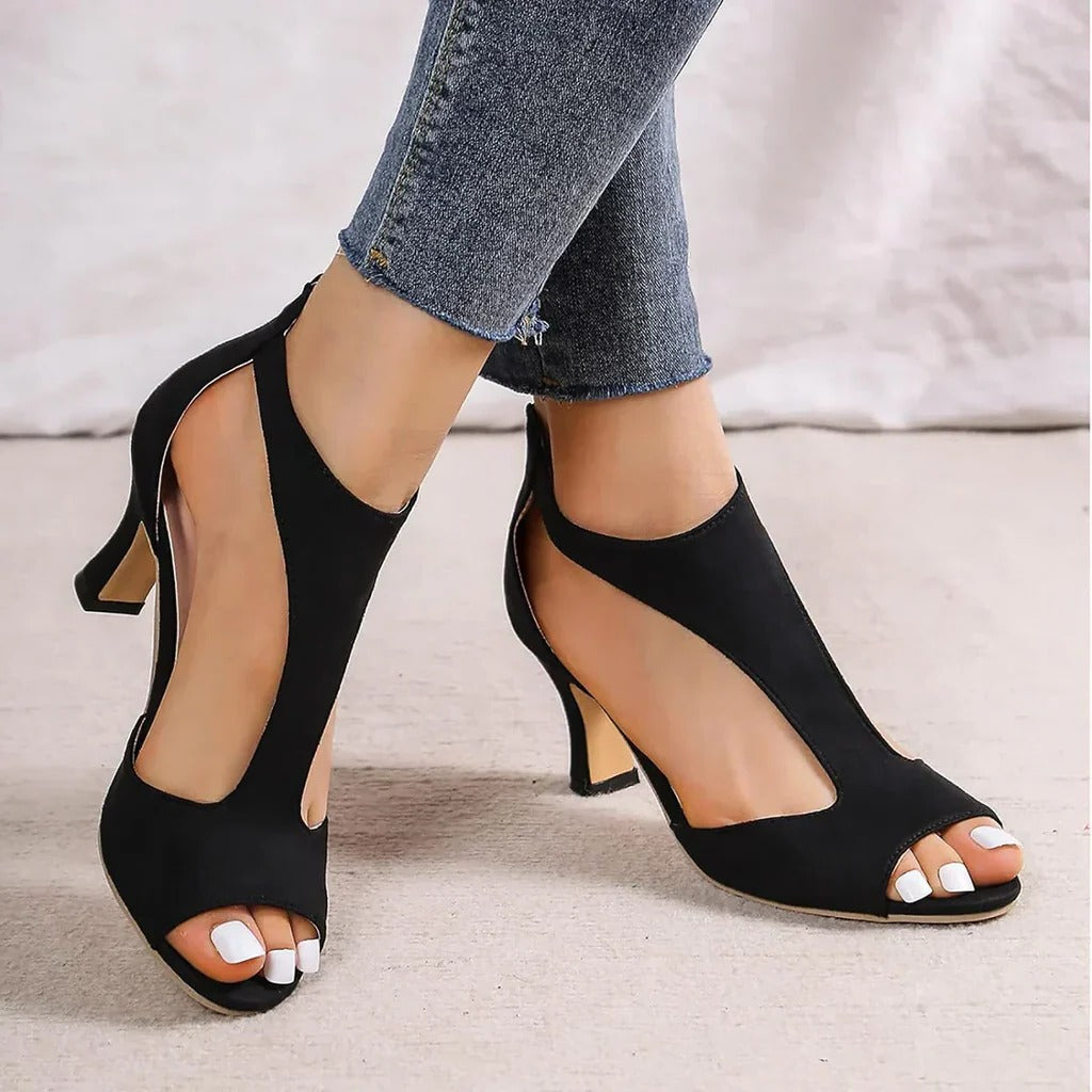 Black orthopedic high heels for women, providing comfortable support and a stylish design for any occasion.