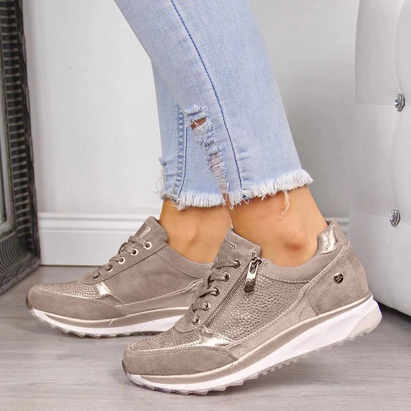 Close-up of women's orthopedic comfort shoes, showcasing arch support and breathable casual design.
