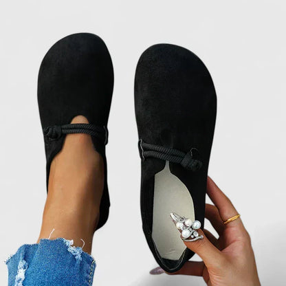 Slip-on women's loafers providing excellent arch support and a cushioned sole for comfortable daily wear.