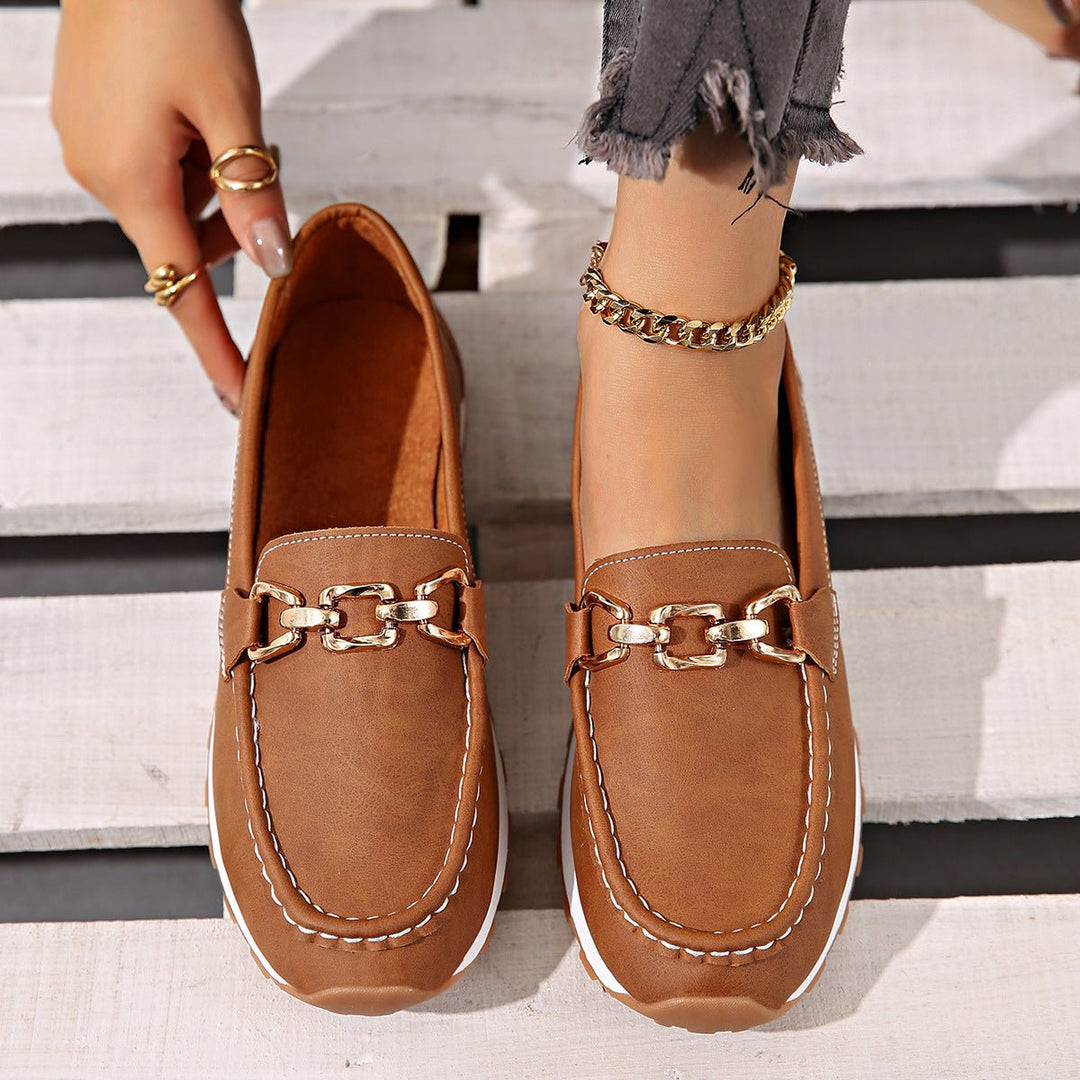Fashionable women's loafers with orthopedic arch support for active lifestyles.