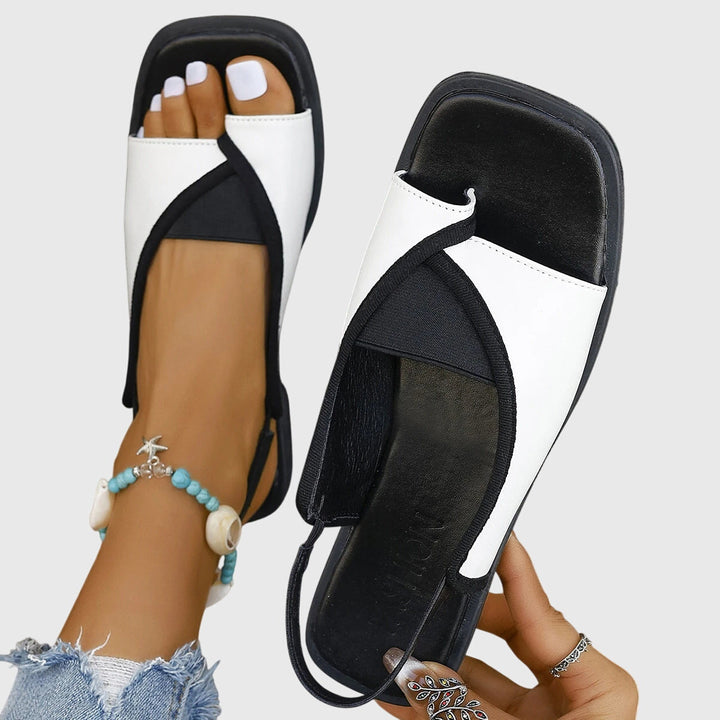 Multi-color women's orthopedic sandals. Open toe, cushioned design for comfortable beach & casual wear.