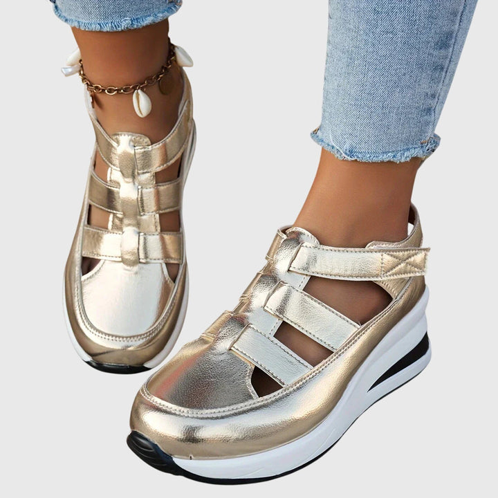 Supportive casual women's sandals featuring adjustable arch support & non-slip sole.