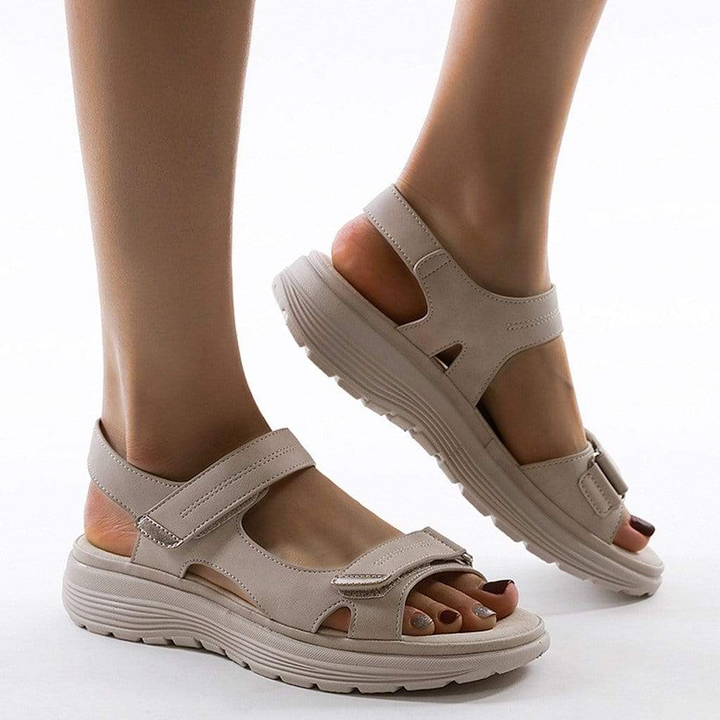 Stylish women's platform orthopedic sandals with adjustable straps, offering support and foot pain relief.