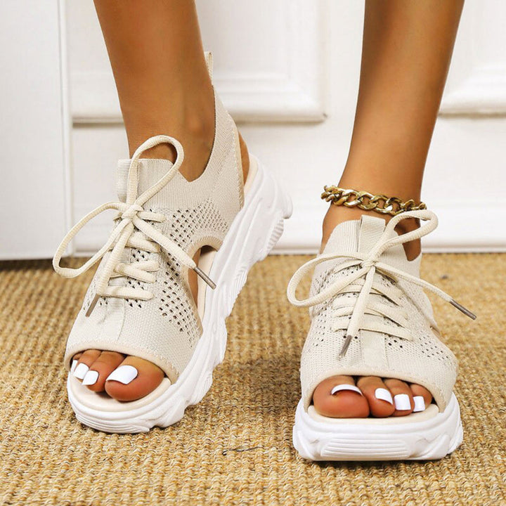 Women's orthopedic sandals on a foot, demonstrating comfort, arch support, and casual summer style.