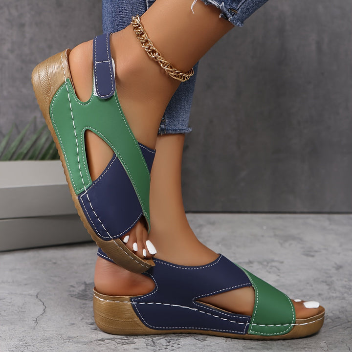 Lightweight women's walking sandals with adjustable straps, orthopedic footbed & arch support for long wear.