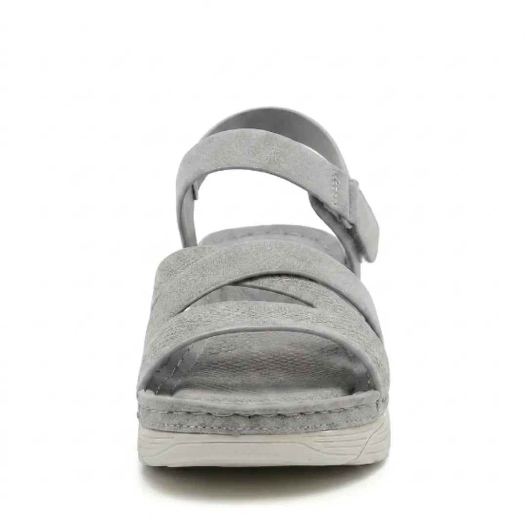 Lightweight women's sandals, designed for foot support, with orthopedic arch & adjustable fit.